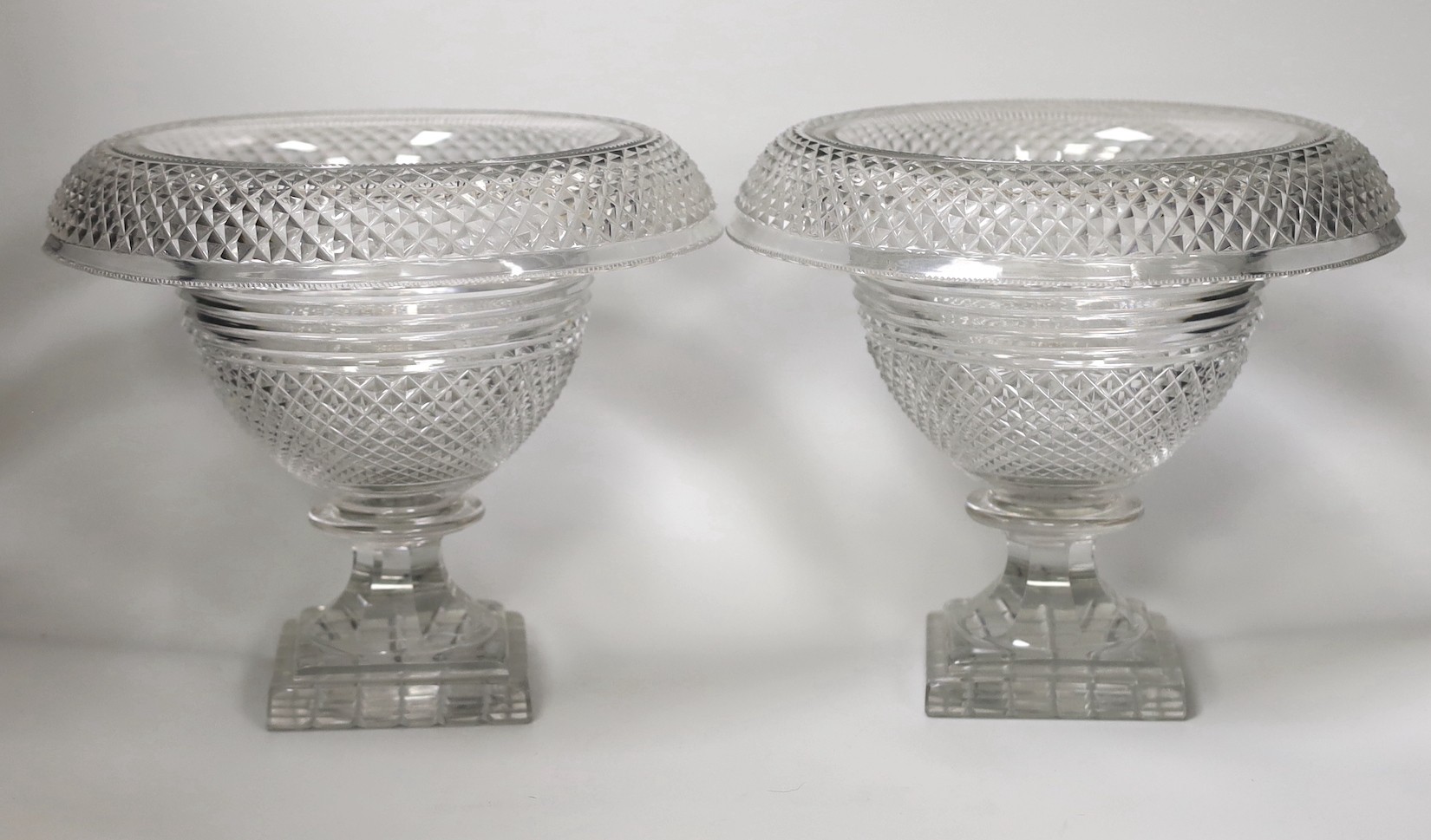 A pair of Georgian cut glass turnover rim pedestal dishes, 22cm tall